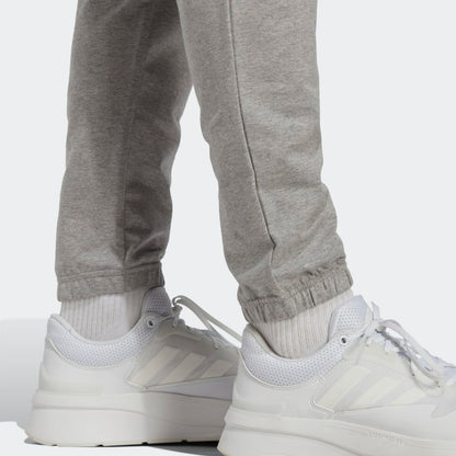 Men's adidas Essentials Single Jersey Tapered Badge of Sport Pants
