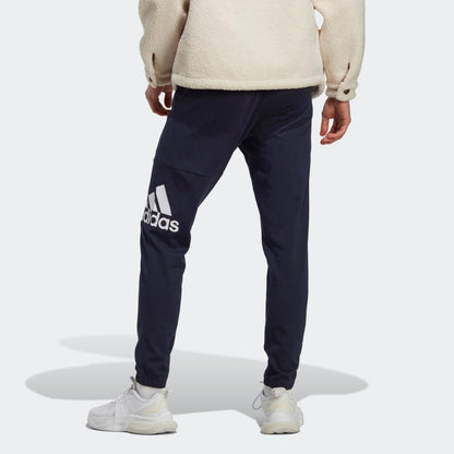 Men's adidas Essentials Single Jersey Tapered Badge of Sport Pants